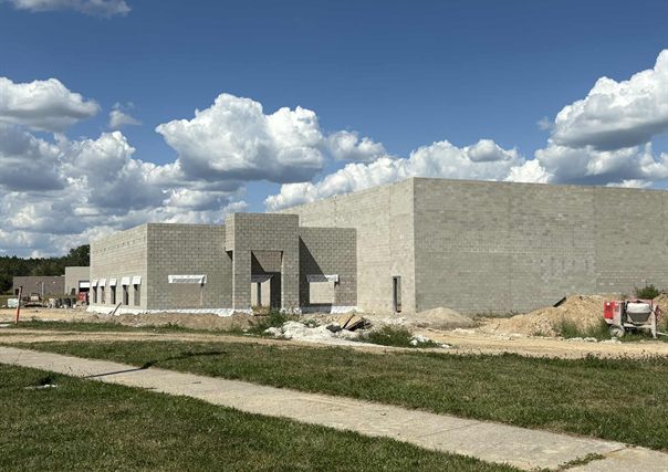Rear and side elevations of the 796 Campus Parkway building, showing the open ground where an addition could be built